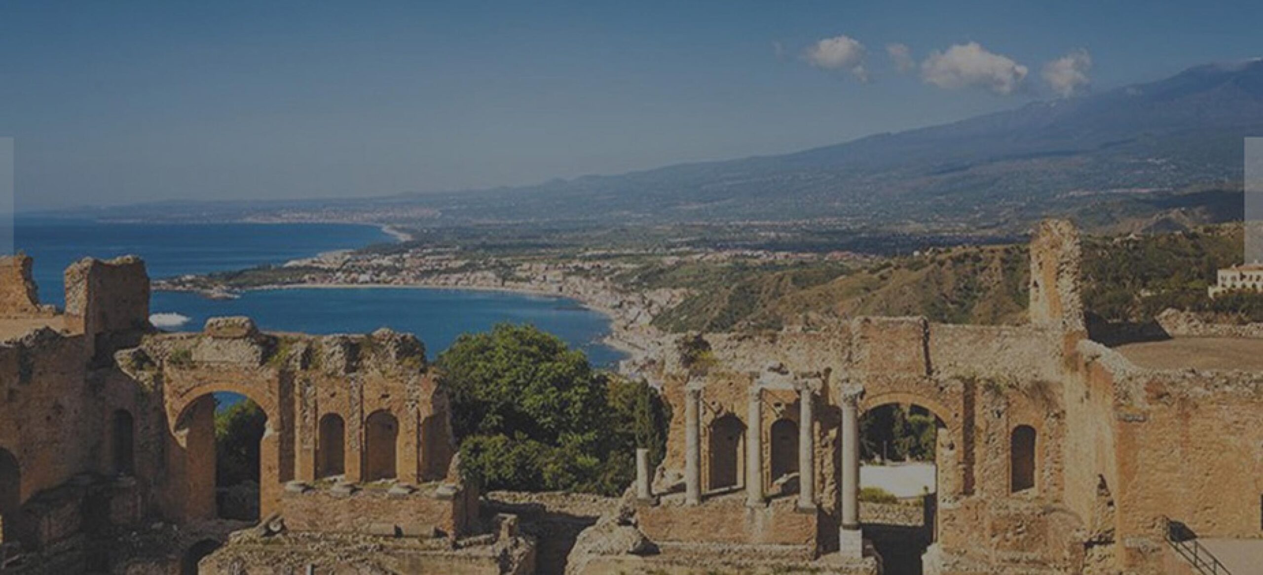 Ancient Greek theatre in Taormina, Sicily, overlooking the coast